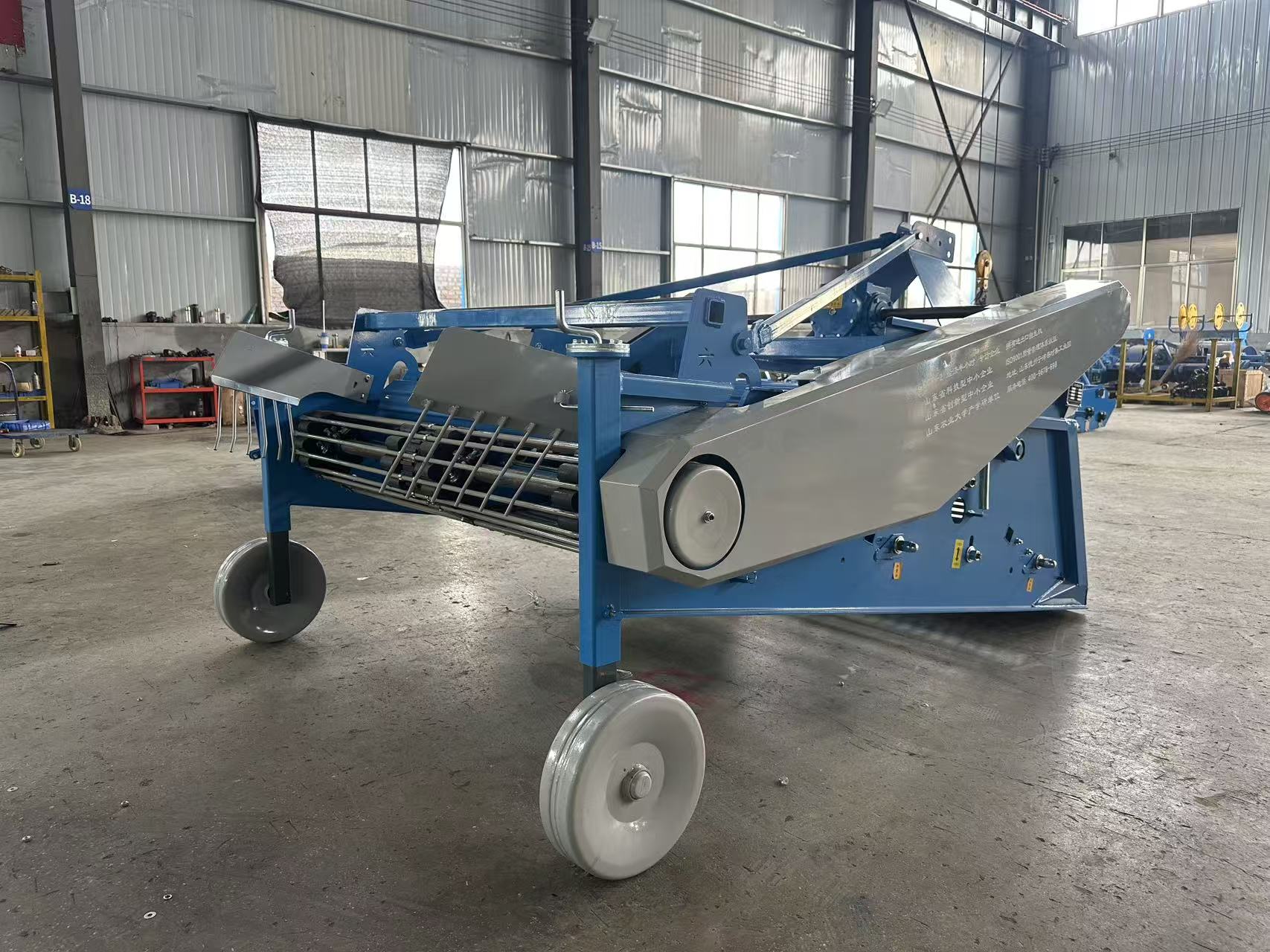 4UY-160 workshop view — discharge chute and drive cover