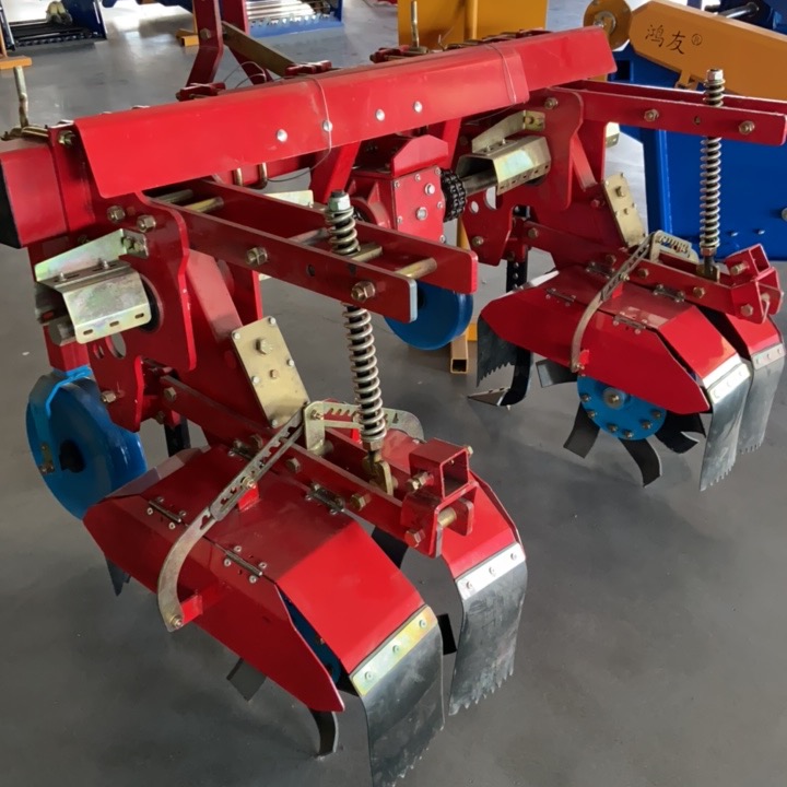 Top-down view — spring-loaded hilling assembly