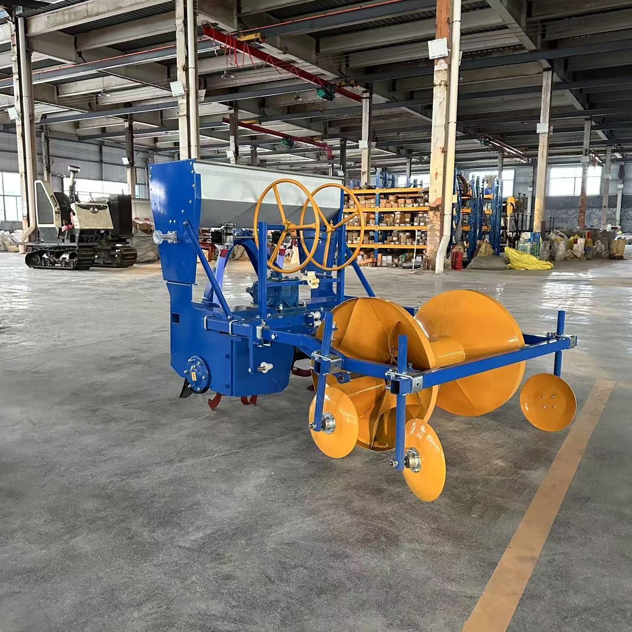 Workshop — side view of ridger and forming roller