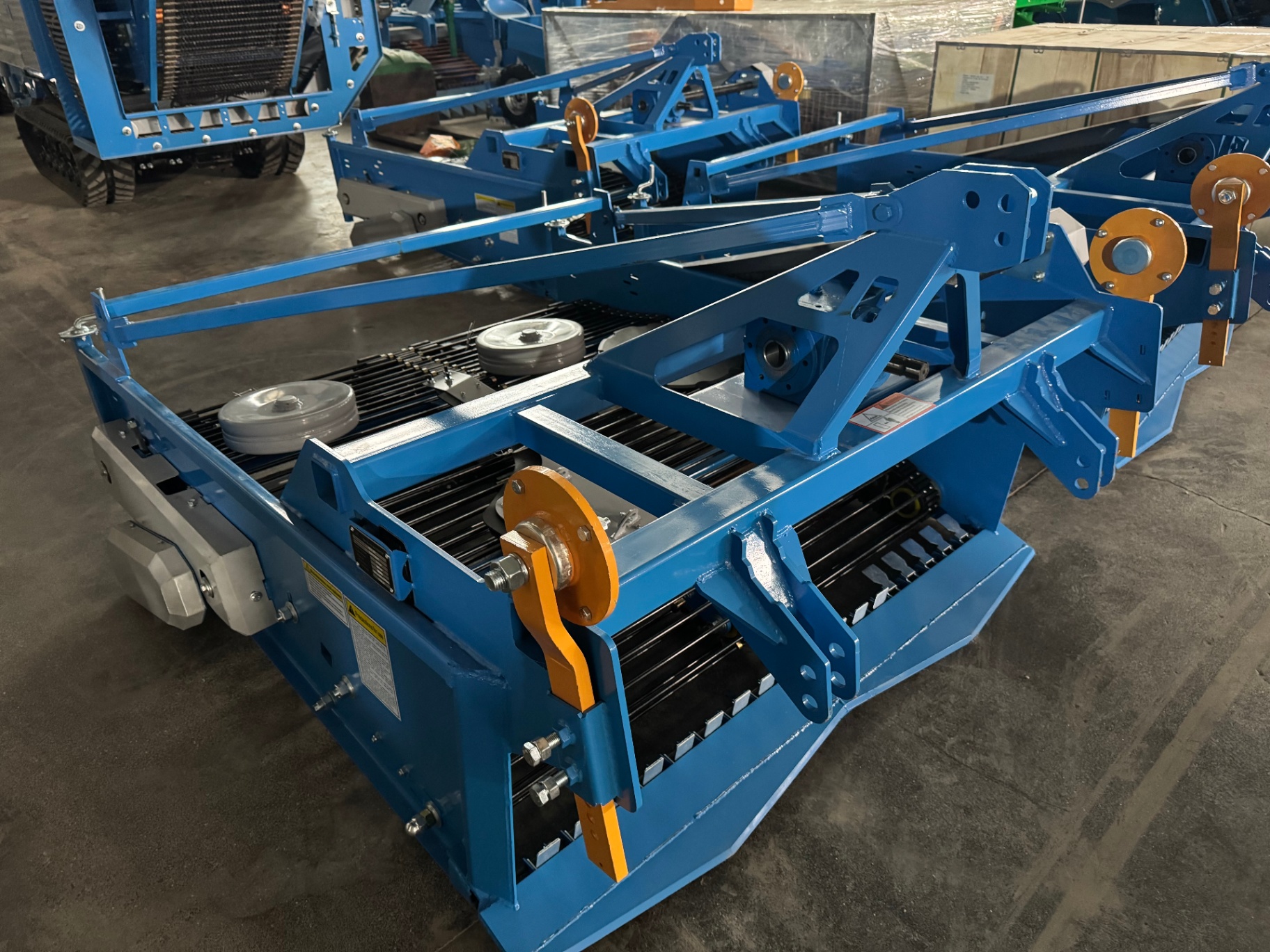 Opposite-side detail — linkage frame and support wheels