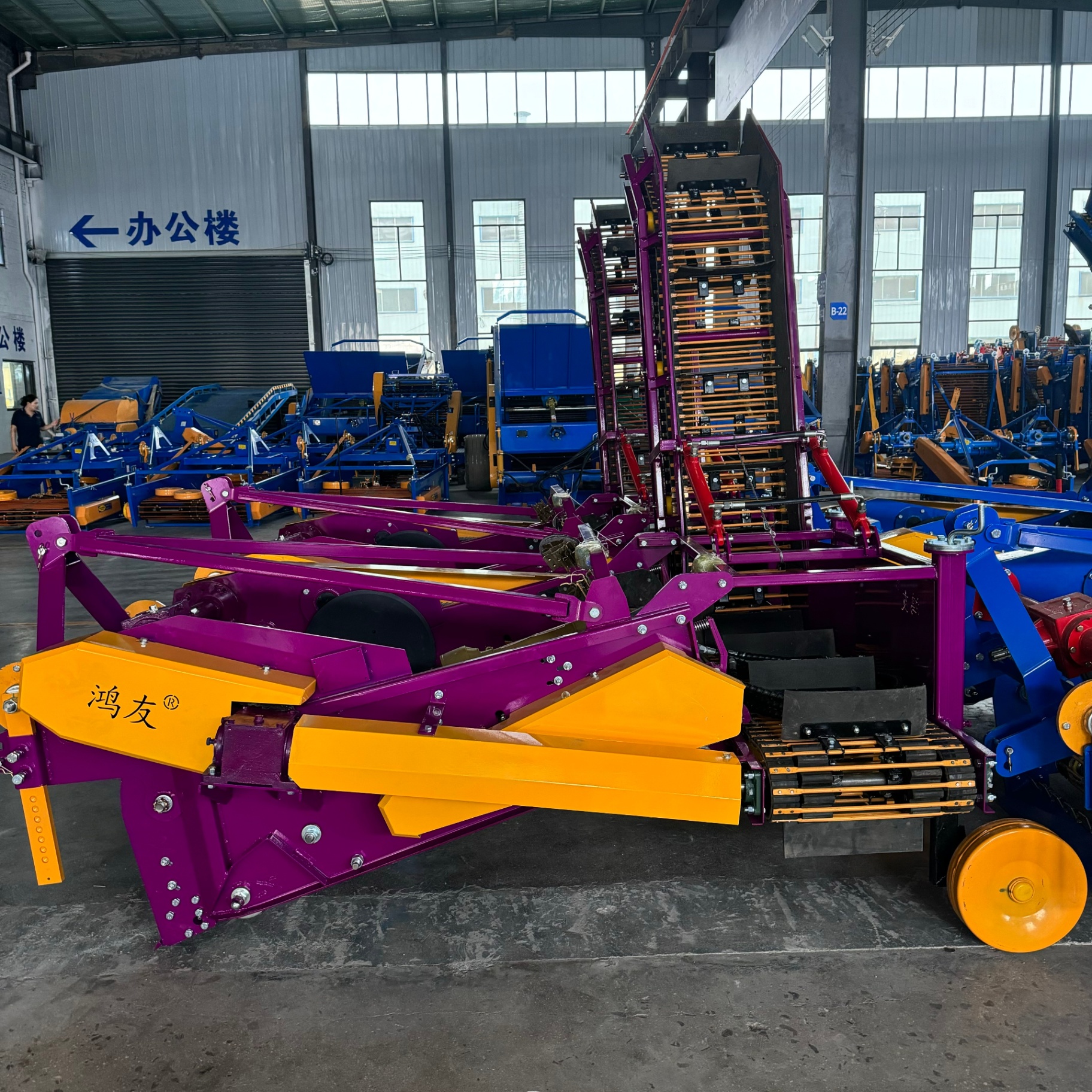 Side view — complete machine with elevator raised