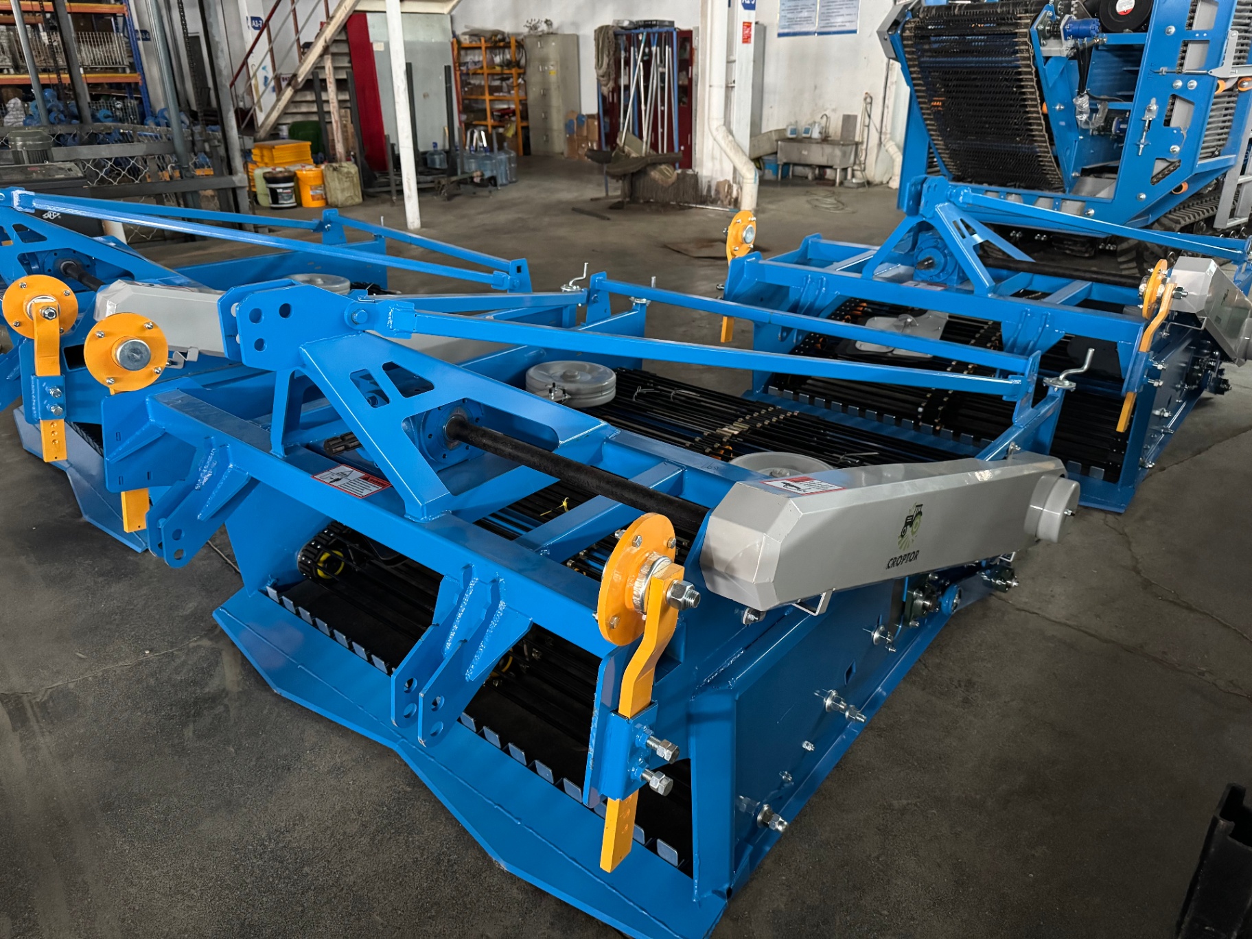 Workshop batch view — multiple 4UX harvesters ready for delivery