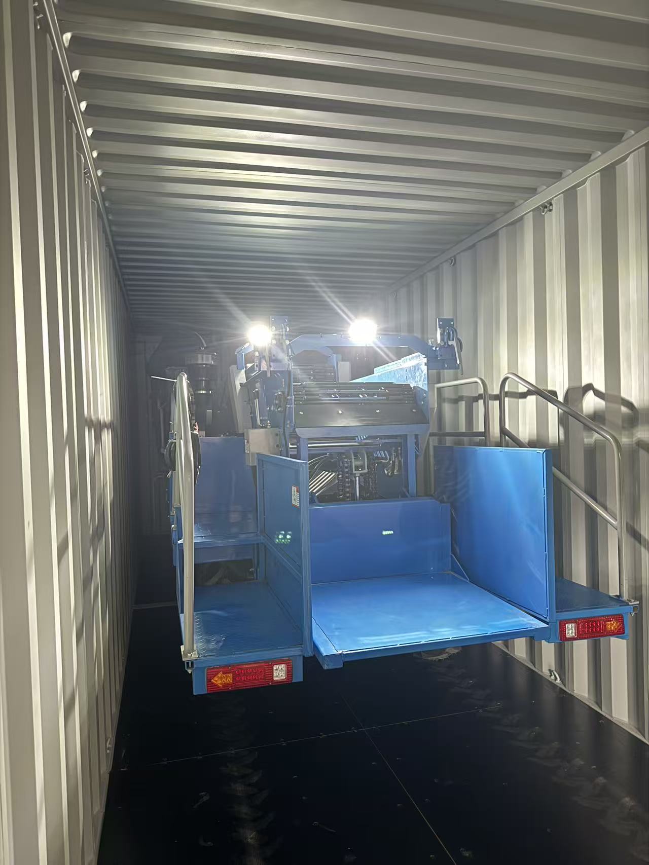 Self-propelled potato combine harvester secured inside a 40HQ container.