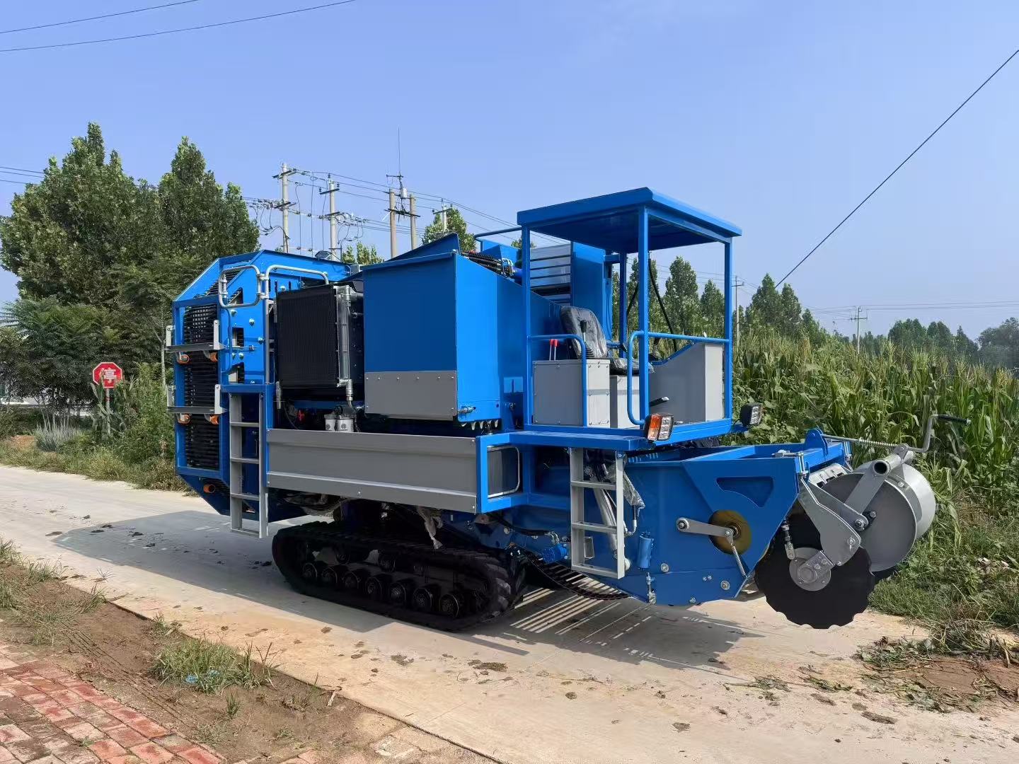 Field-side view — crawler chassis and digging head
