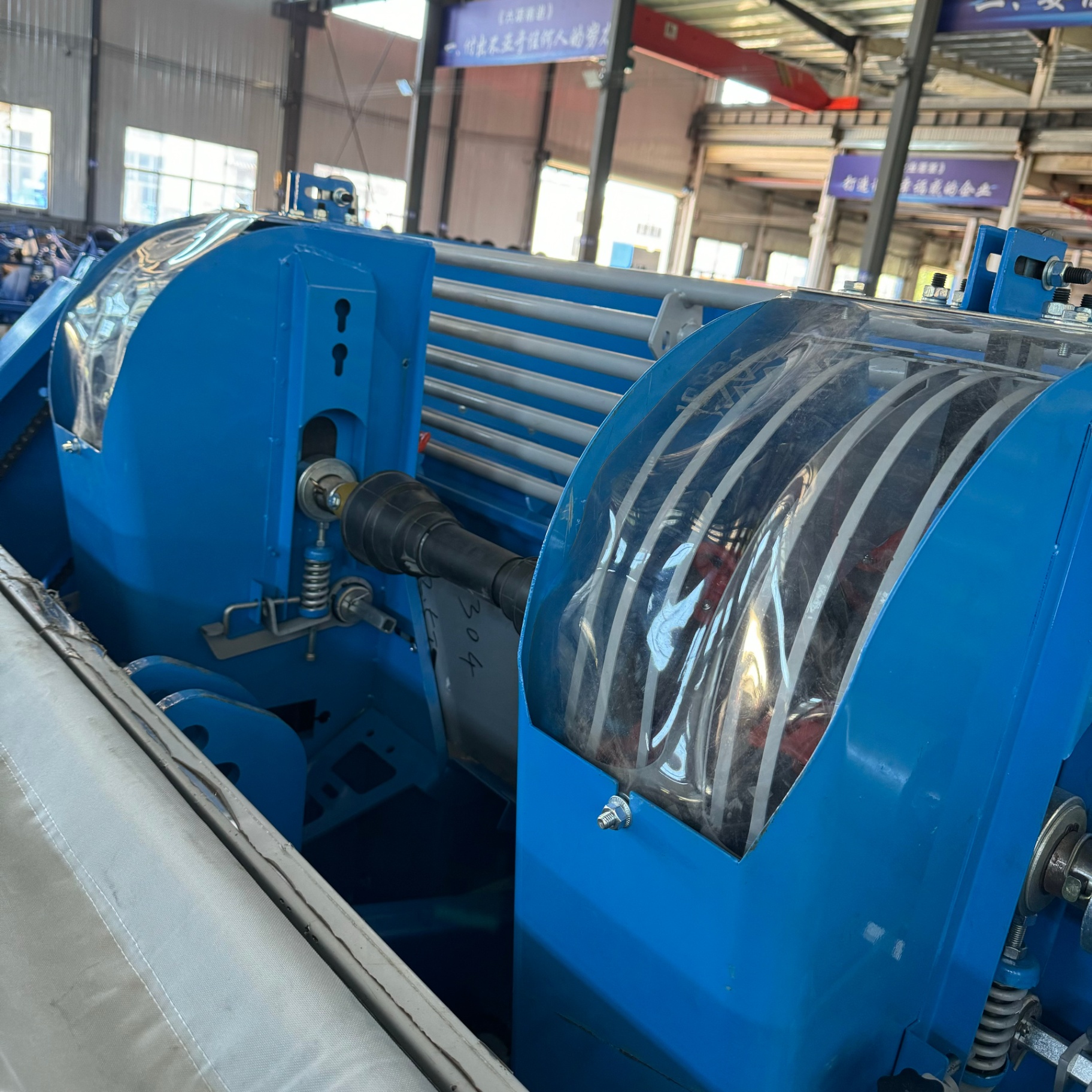 Cup-feed seed metering with protective covers