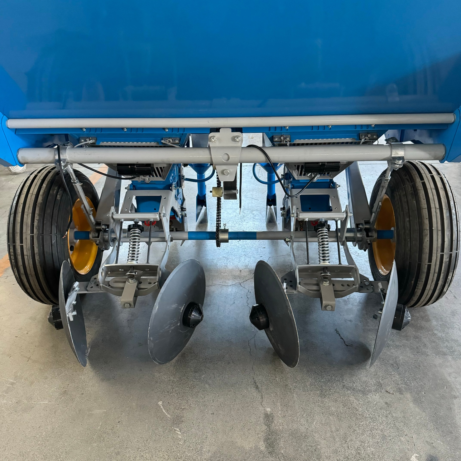 Underside — disc openers, drive chain and press wheels
