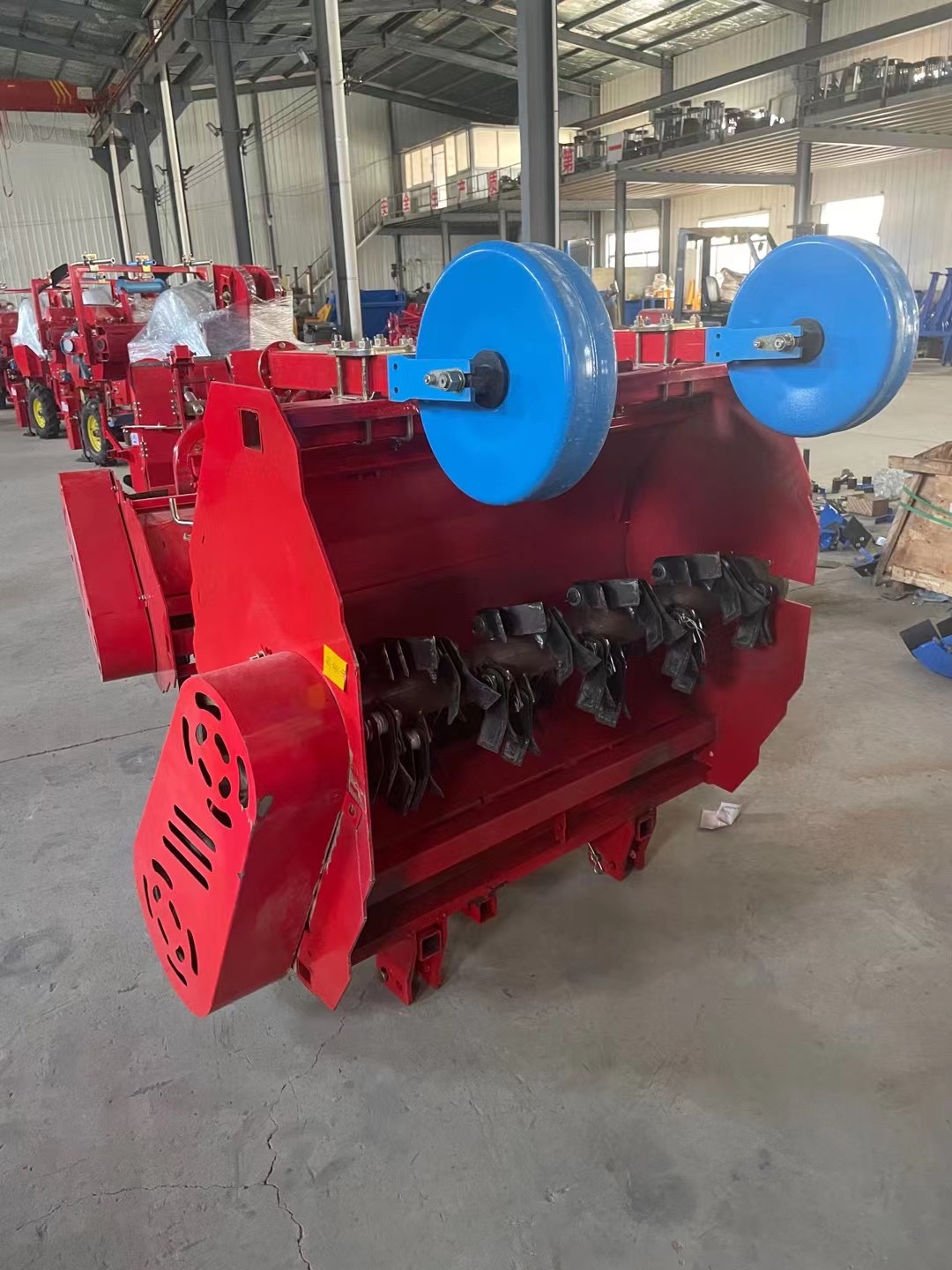 Rear three-quarter — twin pressing rollers and flail rotor detail