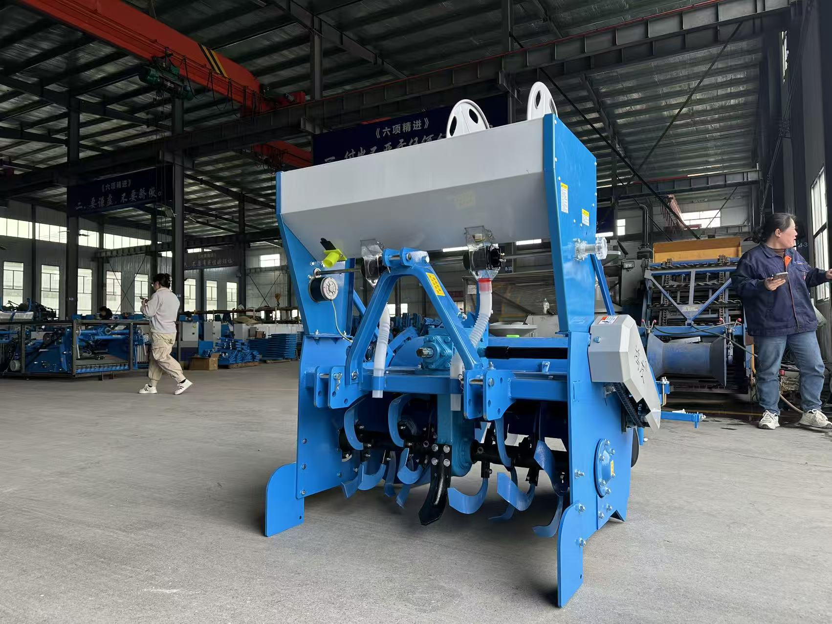 Factory view — rear three-quarter of forming section and rotary tiller