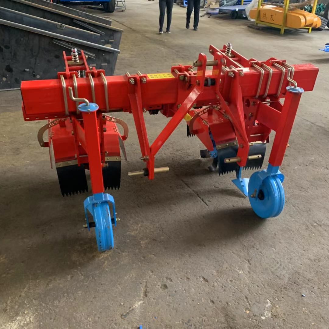 Side view — twin hilling units and depth wheels
