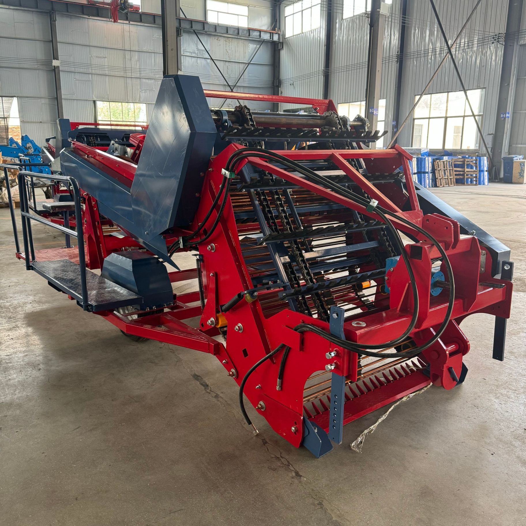 Factory rear-side view — vibrating screen and conveyor chains