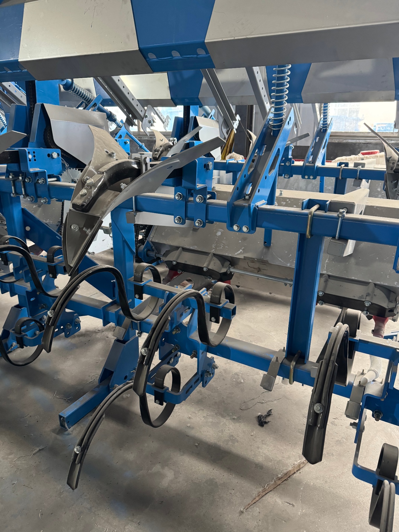 Workshop close-up — ridging mouldboards, side-shields and spring-loaded shanks