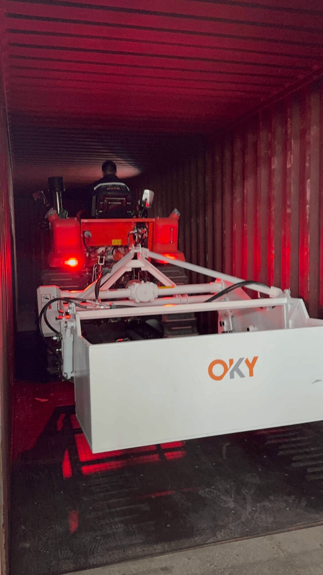 Compact OKY unit loaded into the container at night, showing flexible dispatch scheduling.