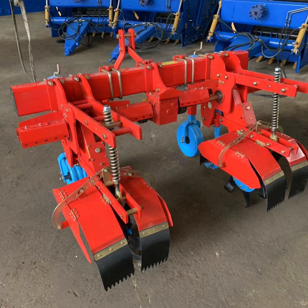Workshop front view — side-throw hoods and gauge wheels