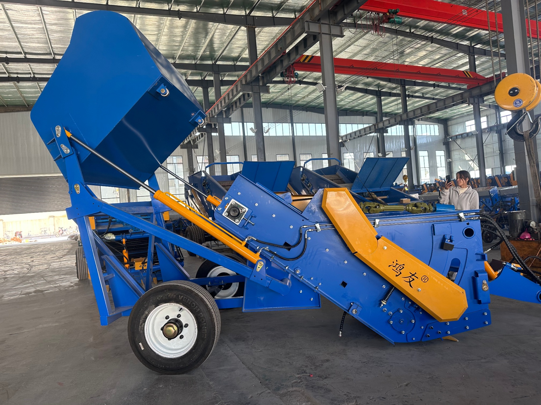 Side view — raised collection box and transfer conveyor