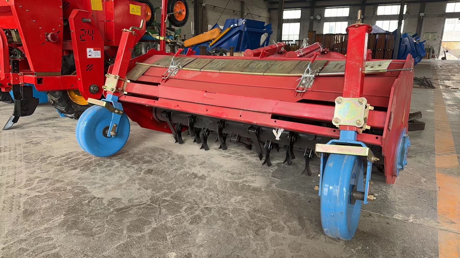 Side detail — flail rotor with caster gauge wheels